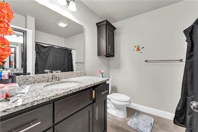 200 Post Oak Ave, Gentry, AR 72734 - full bathroom with vanity, toilet, baseboards, and a shower with curtain