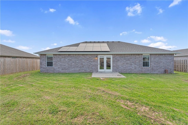 200 Post Oak Ave, Gentry, AR 72734 - rear view of house with french doors, roof mounted solar panels, brick siding, and a patio area