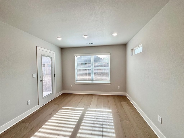 480 S Benchmark Ln, Fayetteville, AR 72704 - empty room with wood finished floors, baseboards, and recessed lighting