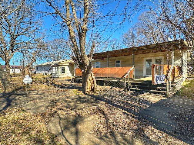 102 Pecan St, Marshall, AR 72650 - rear view of property featuring a porch