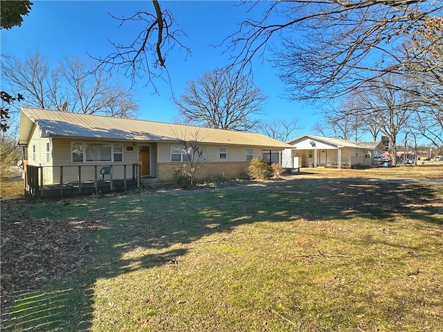102 Pecan St, Marshall, AR 72650 - back of house with a yard and metal roof