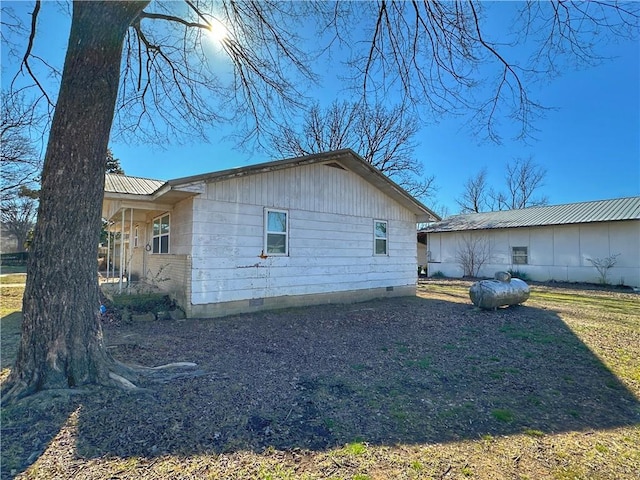 100 Pecan St, Marshall, AR 72650 - view of side of property with crawl space and metal roof