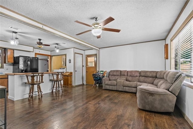 2 Tenbury Ln, Bella Vista, AR 72714 - living area featuring a textured ceiling, ceiling fan, dark wood-style floors, and ornamental molding