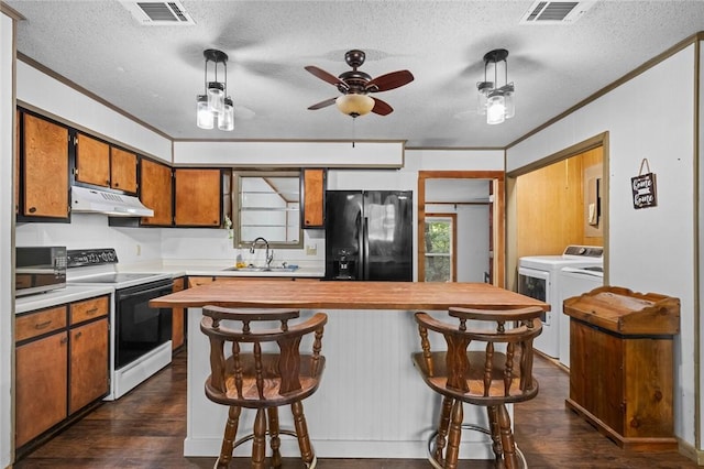 2 Tenbury Ln, Bella Vista, AR 72714 - kitchen featuring electric stove, black refrigerator with ice dispenser, washing machine and clothes dryer, under cabinet range hood, and ornamental molding