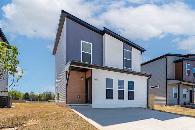 1071 Kentucky Ave, Bentonville, AR 72713 - contemporary house featuring central AC and concrete driveway