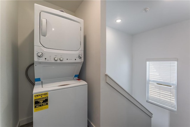 1071 Kentucky Ave, Bentonville, AR 72713 - washroom featuring estacked washer and dryer and recessed lighting