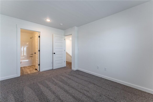 1071 Kentucky Ave, Bentonville, AR 72713 - unfurnished bedroom featuring carpet, baseboards, connected bathroom, and recessed lighting