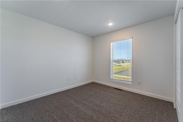 1071 Kentucky Ave, Bentonville, AR 72713 - unfurnished room featuring dark carpet, baseboards, and recessed lighting