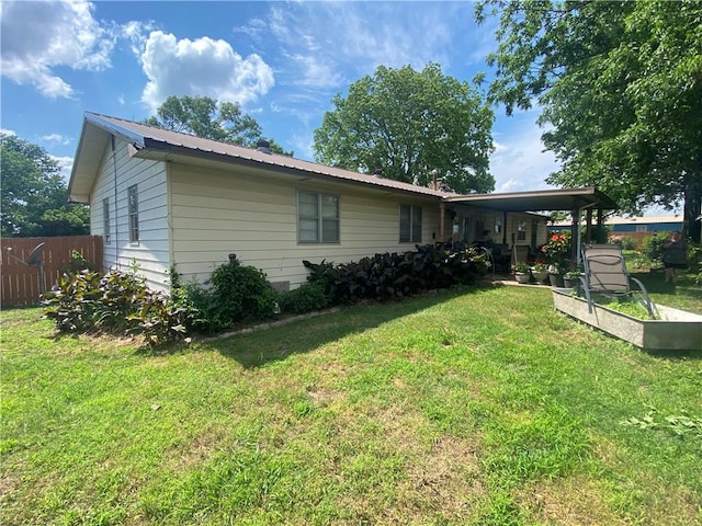 924 W Ave, Lincoln, AR 72744 - view of side of property with metal roof and a vegetable garden