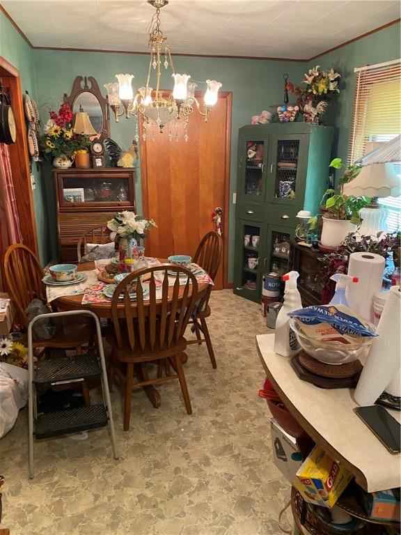 924 W Ave, Lincoln, AR 72744 - dining area with a chandelier and ornamental molding