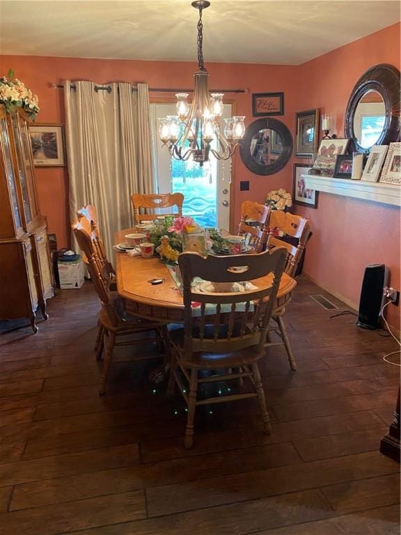 924 W Ave, Lincoln, AR 72744 - dining space featuring dark wood-style floors and a chandelier
