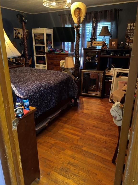 924 W Ave, Lincoln, AR 72744 - bedroom with hardwood / wood-style flooring