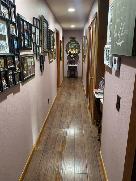 924 W Ave, Lincoln, AR 72744 - corridor featuring wood-type flooring, baseboards, and recessed lighting