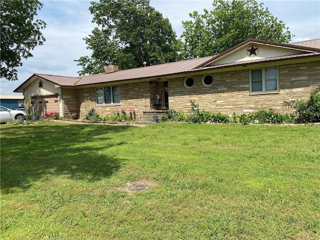 924 W Ave, Lincoln, AR 72744 - ranch-style home featuring stone siding, metal roof, a front lawn, a chimney, and an attached garage