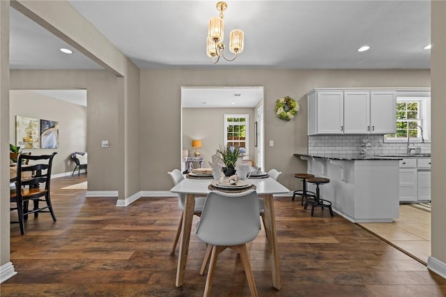 1 Geyer Rd, Bentonville, AR 72712 - dining room featuring plenty of natural light, recessed lighting, a chandelier, and dark wood-style flooring