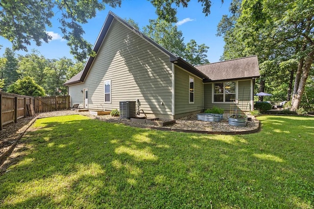 26 Primrose Ln, Bella Vista, AR 72714 - back of house featuring cooling unit and a shingled roof