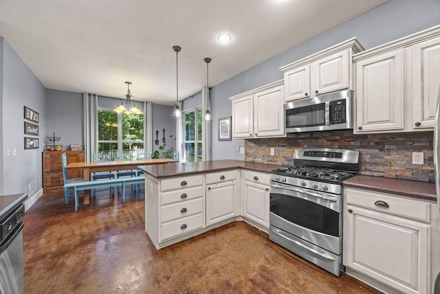 26 Primrose Ln, Bella Vista, AR 72714 - kitchen with stainless steel appliances, concrete floors, a peninsula, dark countertops, and recessed lighting