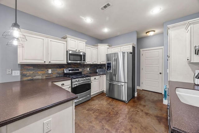 26 Primrose Ln, Bella Vista, AR 72714 - kitchen with stainless steel appliances, dark countertops, concrete floors, tasteful backsplash, and recessed lighting