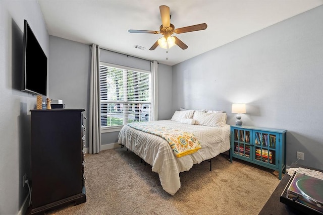 26 Primrose Ln, Bella Vista, AR 72714 - bedroom with carpet flooring, baseboards, and ceiling fan