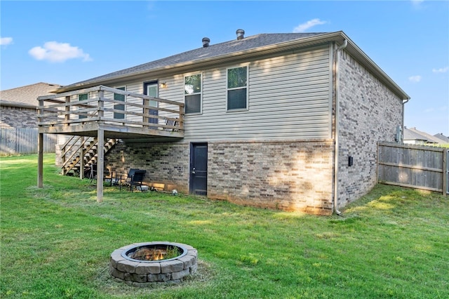 1505 S K Pl, Rogers, AR 72756 - back of property with stairs, a wooden deck, brick siding, and a fire pit