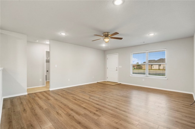1505 S K Pl, Rogers, AR 72756 - empty room featuring a ceiling fan, light wood-type flooring, recessed lighting, and baseboards