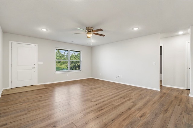 1505 S K Pl, Rogers, AR 72756 - unfurnished room featuring a ceiling fan, wood finished floors, recessed lighting, and baseboards