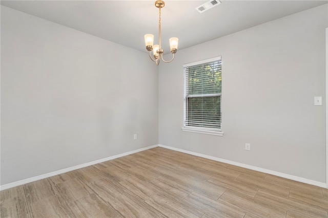 1505 S K Pl, Rogers, AR 72756 - empty room with a chandelier, light wood-type flooring, and baseboards