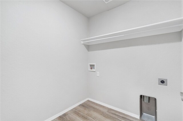 1505 S K Pl, Rogers, AR 72756 - laundry room featuring hookup for a washing machine, electric dryer hookup, baseboards, and light wood-style flooring