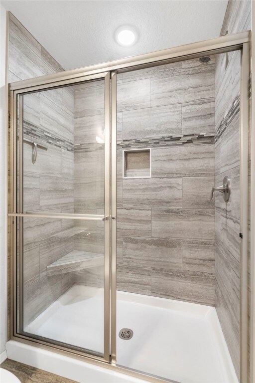 1505 S K Pl, Rogers, AR 72756 - bathroom featuring a stall shower