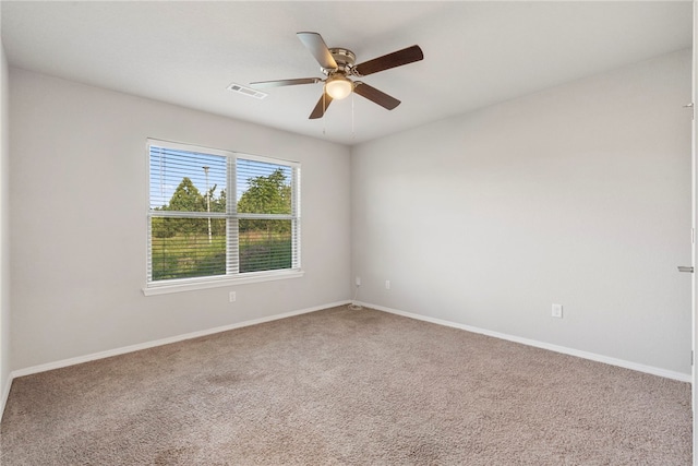 1505 S K Pl, Rogers, AR 72756 - spare room featuring ceiling fan, carpet, and baseboards