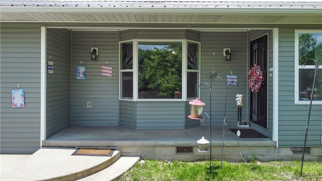 108 Clive St, Berryville, AR 72616 - doorway to property with covered porch and metal roof
