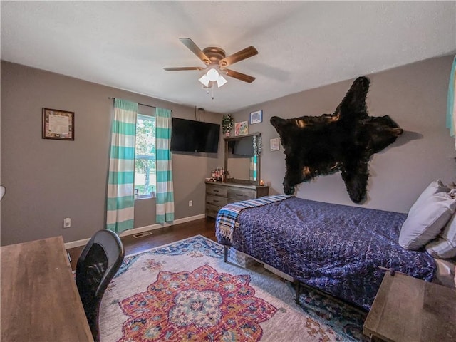 108 Clive St, Berryville, AR 72616 - bedroom featuring baseboards, ceiling fan, and wood finished floors