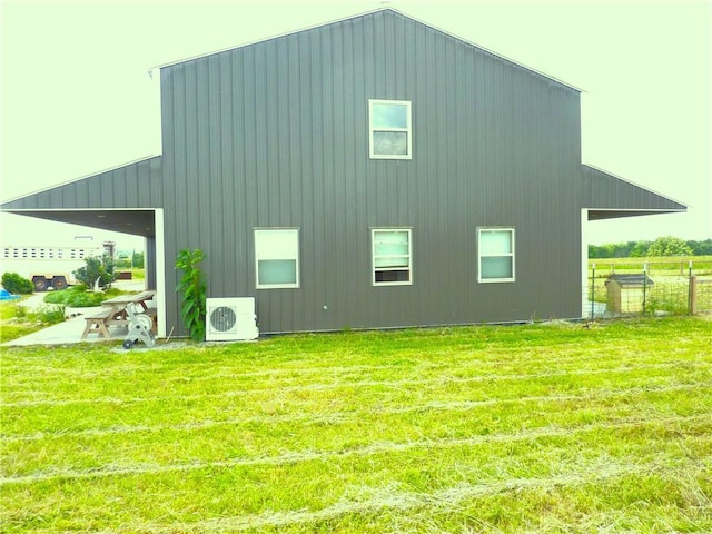 6611 Mc 4010, Everton, AR 72633 - rear view of property with ac unit, a yard, and board and batten siding