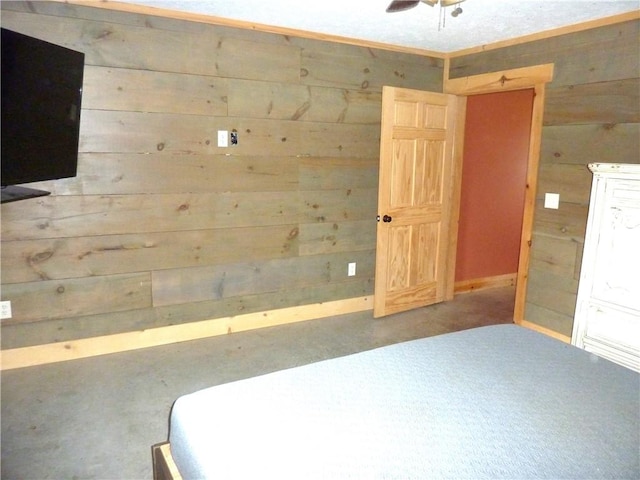 6611 Mc 4010, Everton, AR 72633 - unfurnished bedroom with wooden walls, baseboards, and a ceiling fan