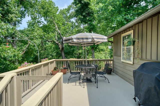 122 Hillcrest Rd, Eureka Springs, AR 72631 - wooden deck featuring outdoor dining area, area for grilling, and view of scattered trees