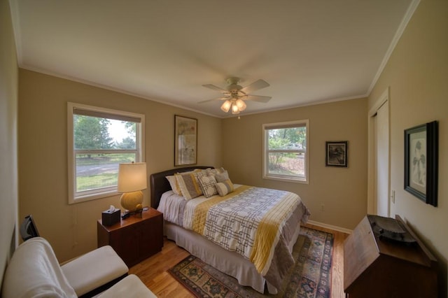 122 Hillcrest Rd, Eureka Springs, AR 72631 - bedroom featuring ornamental molding, light wood-type flooring, baseboards, and ceiling fan