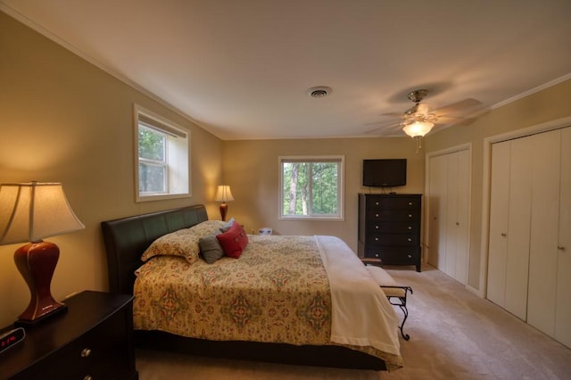 122 Hillcrest Rd, Eureka Springs, AR 72631 - bedroom featuring light colored carpet, multiple windows, multiple closets, ornamental molding, and a ceiling fan