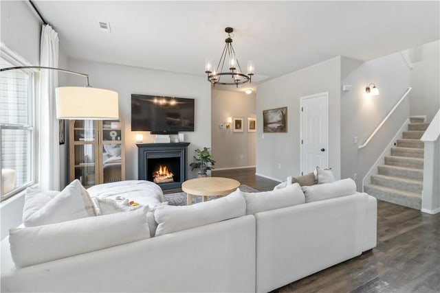 501 W Pittsfield, Siloam Springs, AR 72761 - living area with dark wood-style flooring, baseboards, stairs, and a lit fireplace