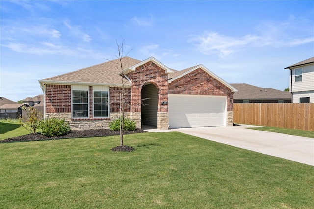615 W Dusty Ct, Siloam Springs, AR 72761 - view of front of home with an attached garage, roof with shingles, concrete driveway, stone siding, and brick siding