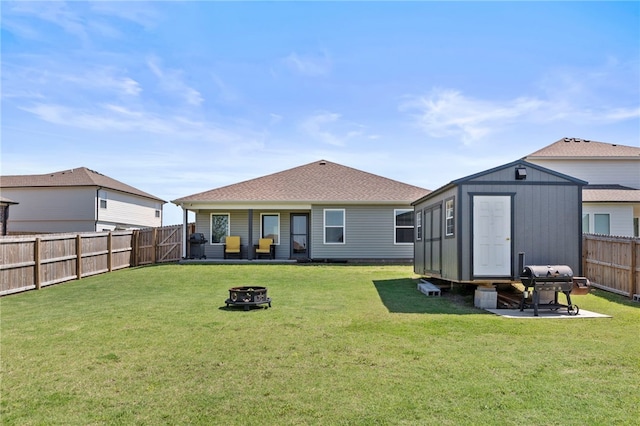 615 W Dusty Ct, Siloam Springs, AR 72761 - back of property with a fire pit and roof with shingles