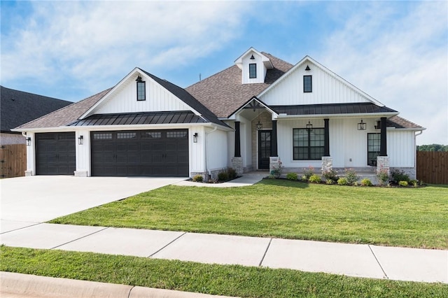 1909 Crump St, Pea Ridge, AR 72751 - modern farmhouse featuring a standing seam roof, an attached garage, concrete driveway, a shingled roof, and metal roof