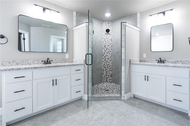 1909 Crump St, Pea Ridge, AR 72751 - bathroom with a shower stall, two vanities, and tile patterned flooring