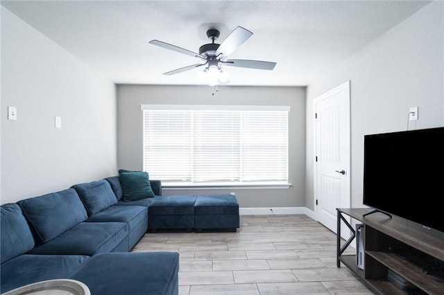 1909 Crump St, Pea Ridge, AR 72751 - living room featuring ceiling fan and baseboards