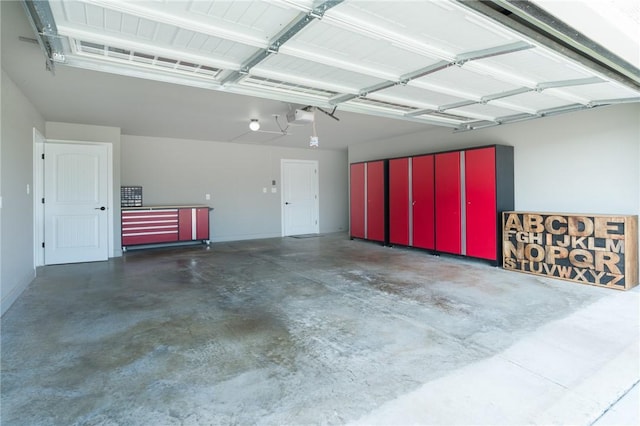 1909 Crump St, Pea Ridge, AR 72751 - garage with a garage door opener and baseboards