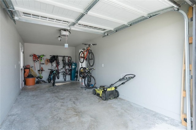 1909 Crump St, Pea Ridge, AR 72751 - garage featuring a garage door opener