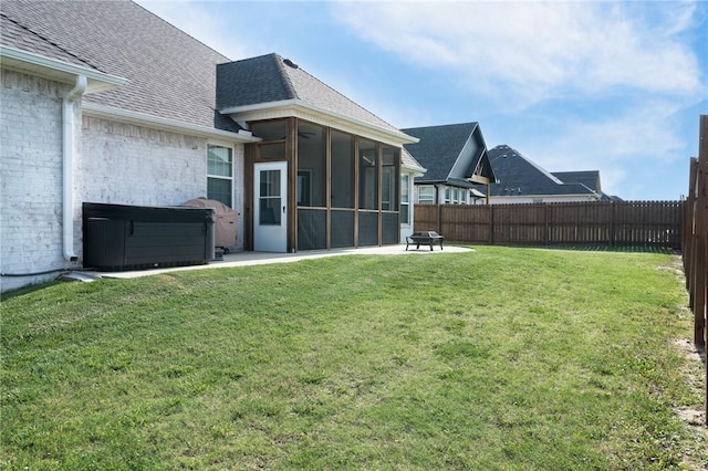 1909 Crump St, Pea Ridge, AR 72751 - view of yard with a sunroom, a hot tub, a patio area, and an outdoor fire pit