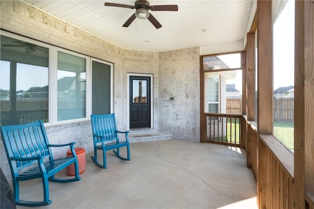 1909 Crump St, Pea Ridge, AR 72751 - sunroom with ceiling fan and healthy amount of natural light