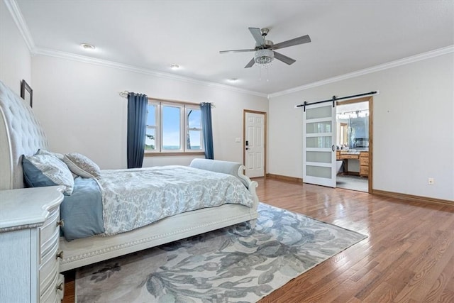 5 Augusta Ln, Holiday Island, AR 72631 - bedroom with wood finished floors, a barn door, crown molding, baseboards, and ceiling fan