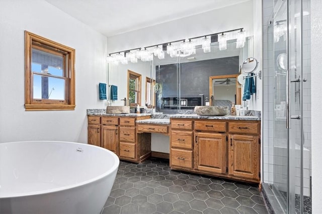 5 Augusta Ln, Holiday Island, AR 72631 - bathroom featuring a freestanding bath, vanity, a stall shower, and tile patterned flooring
