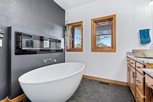 5 Augusta Ln, Holiday Island, AR 72631 - bathroom with vanity, a soaking tub, baseboards, and tile patterned floors